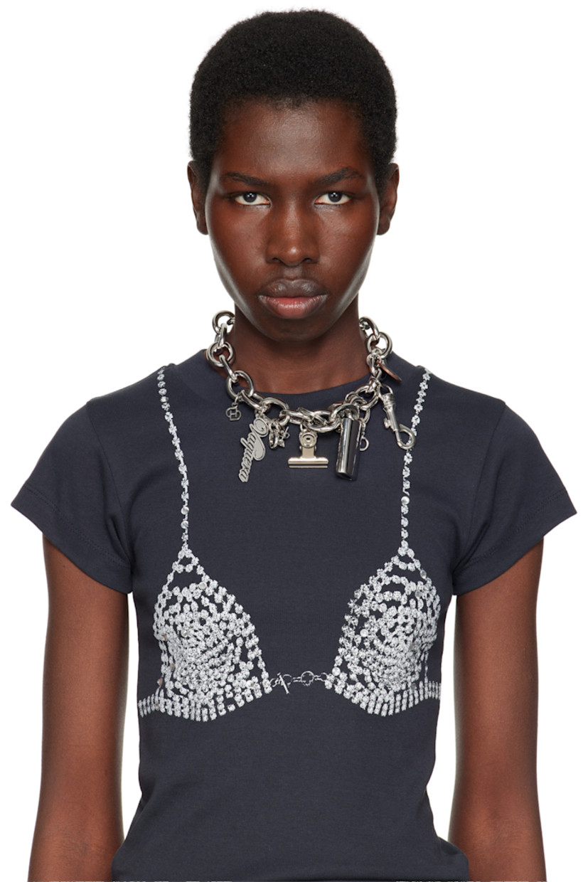 Cable chain necklace in stainless steel, sterling silver, and silver-tone brass. 

· Logo and graphic charms at length
· Prong-set cubic zirconia charms 
· Spring-ring fastening 
· L15"

Part of the D'heygere x Vaquera collaboration. 

Supplier color: Silver/White