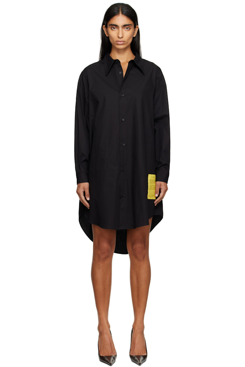 Cotton poplin minidress.

· Spread collar
· Button closure
· Logo patch at front
· Asymmetrical shirttail hem
· Dropped shoulders
· Buttoned barrel cuffs
· Pleats at back yoke
· White stitching at back collar

Supplier color: Black