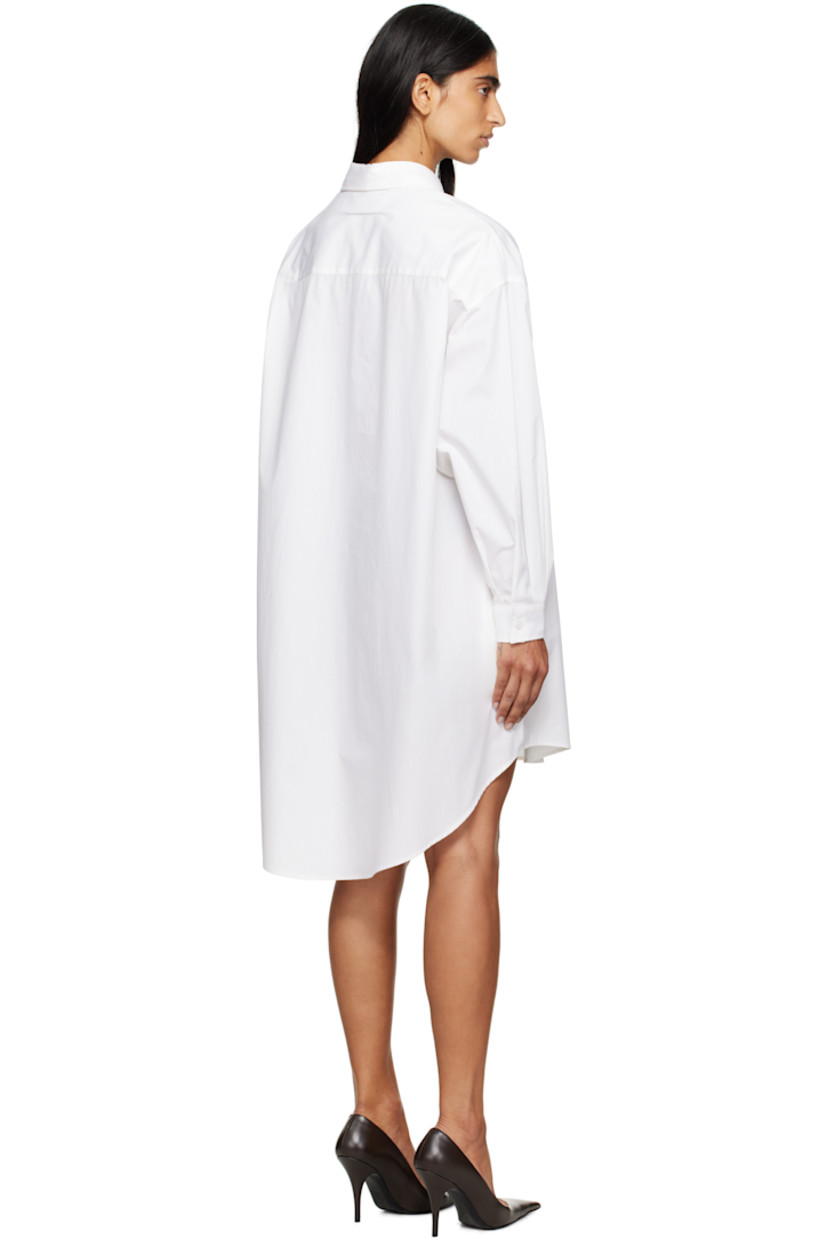 Cotton poplin minidress.

· Spread collar
· Button closure
· Logo patch at front
· Asymmetrical shirttail hem
· Dropped shoulders
· Buttoned barrel cuffs
· Pleats at back yoke
· White stitching at back collar

Supplier color: White