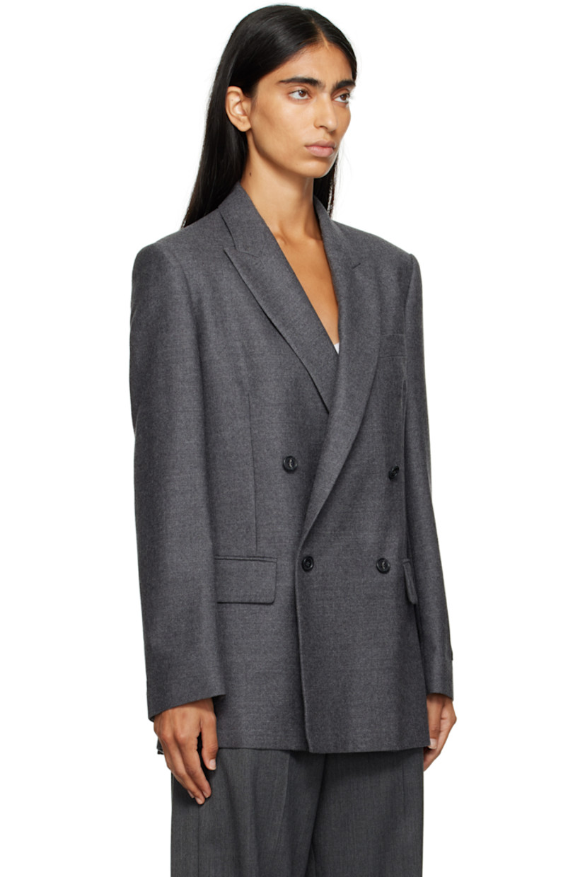 Virgin wool flannel blazer.

· Peaked lapel
· Double-breasted button closure
· Welt pocket at chest
· Flap pockets at front
· Padded shoulders
· Logo patch at cuff
· Surgeon's cuffs
· White stitching at back collar
· Vents at back hem
· Welt pocket at interior
· Full satin lining

Supplier color: Dark grey