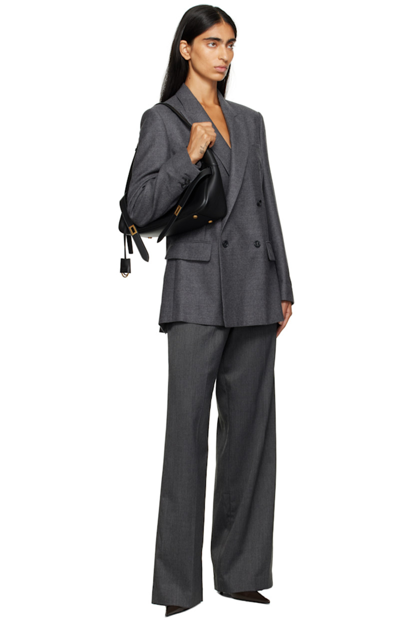 Virgin wool flannel blazer.

· Peaked lapel
· Double-breasted button closure
· Welt pocket at chest
· Flap pockets at front
· Padded shoulders
· Logo patch at cuff
· Surgeon's cuffs
· White stitching at back collar
· Vents at back hem
· Welt pocket at interior
· Full satin lining

Supplier color: Dark grey