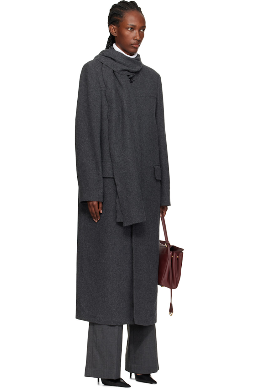 Wool-blend melton coat.

· Integrated scarf at notched lapel
· Button closure
· Flap pockets at front
· White stitching at back collar
· Central vent at back hem
· Welt pocket at interior
· Full satin lining

Supplier color: Dark grey Melange