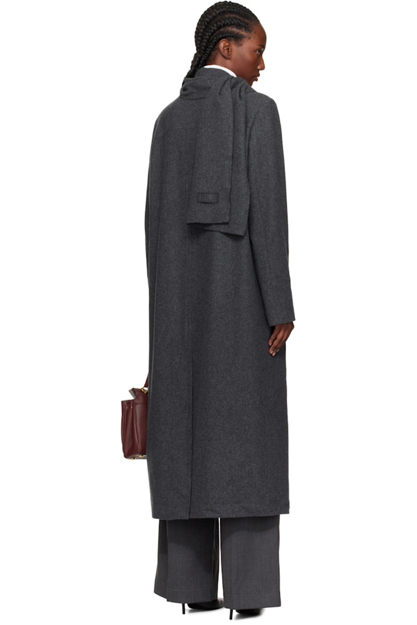 Wool-blend melton coat.

· Integrated scarf at notched lapel
· Button closure
· Flap pockets at front
· White stitching at back collar
· Central vent at back hem
· Welt pocket at interior
· Full satin lining

Supplier color: Dark grey Melange