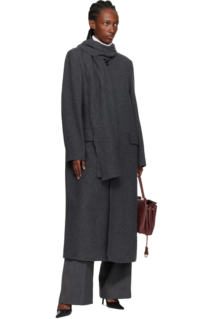 Wool-blend melton coat.

· Integrated scarf at notched lapel
· Button closure
· Flap pockets at front
· White stitching at back collar
· Central vent at back hem
· Welt pocket at interior
· Full satin lining

Supplier color: Dark grey Melange