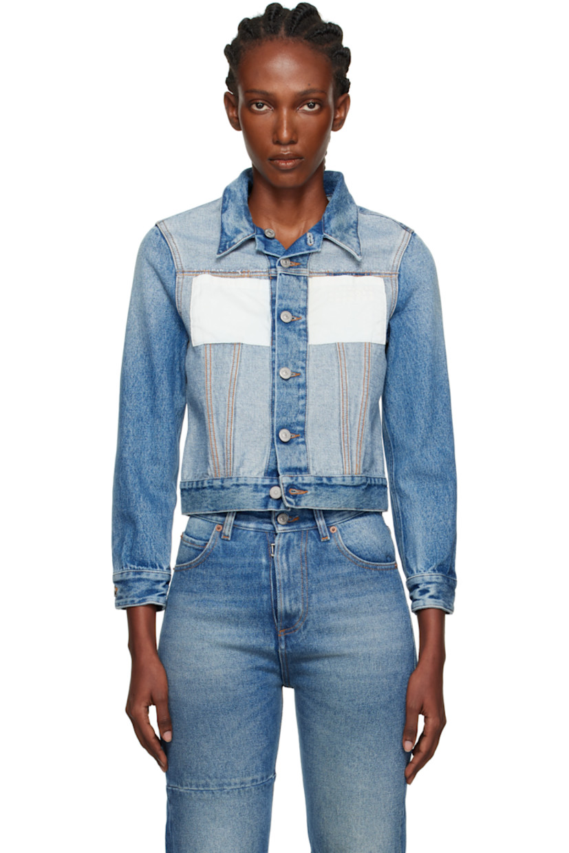 Non-stretch denim jacket.

· Fading throughout.
· Spread collar
· Button closure
· Patch pockets and embroidered logo at chest
· Buttoned barrel cuffs
· White stitching at back collar
· Adjustable button tabs at back hem
· Contrast stitching in tan

Supplier color: Medium blue