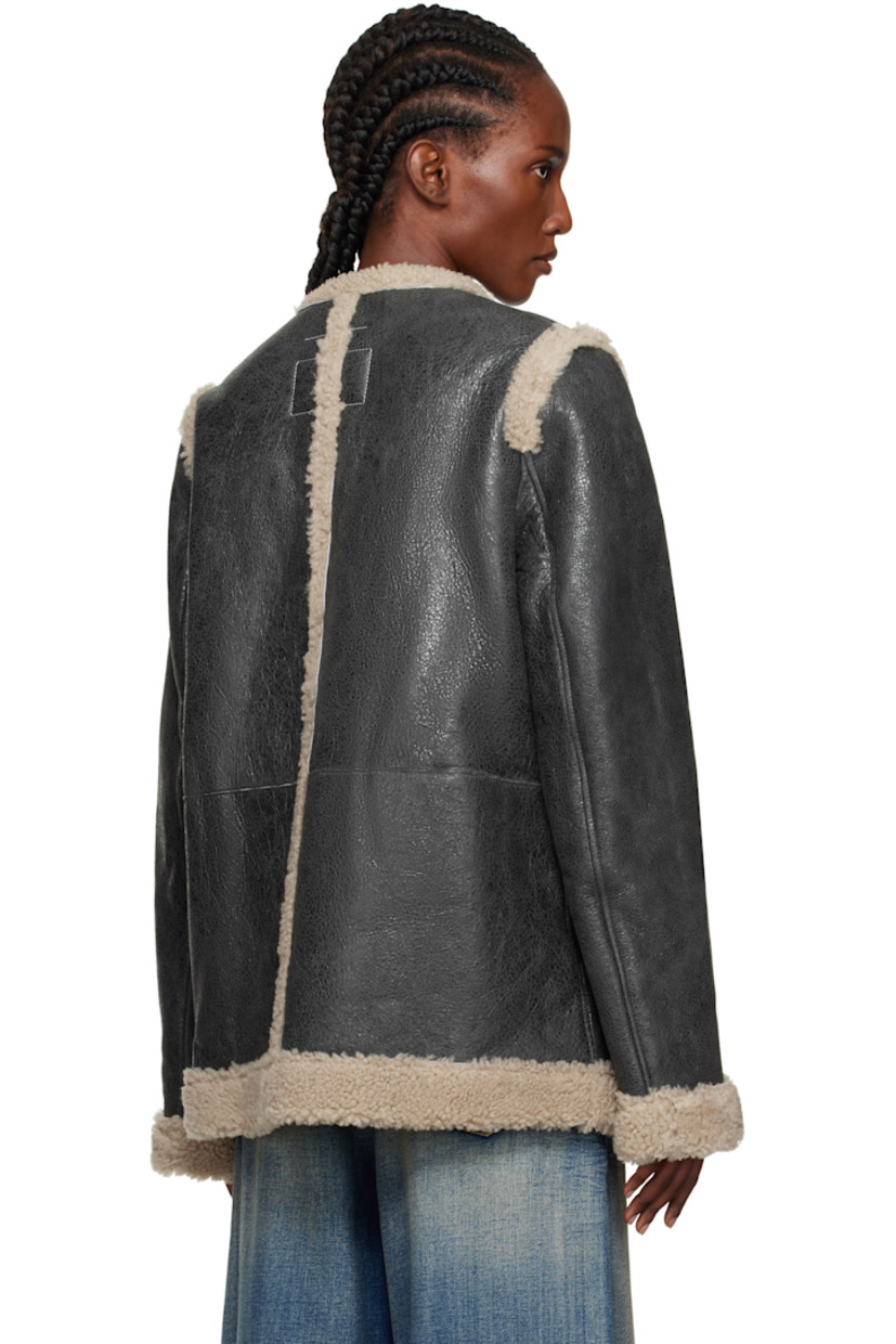 Cracked lambskin jacket.

· Shearling trim throughout
· Round neck
· Hook-eye closure
· Patch pockets at front
· White stitching at back collar
· Welt pockets at interior
· Shearling interior

Supplier color: Beige/Black
