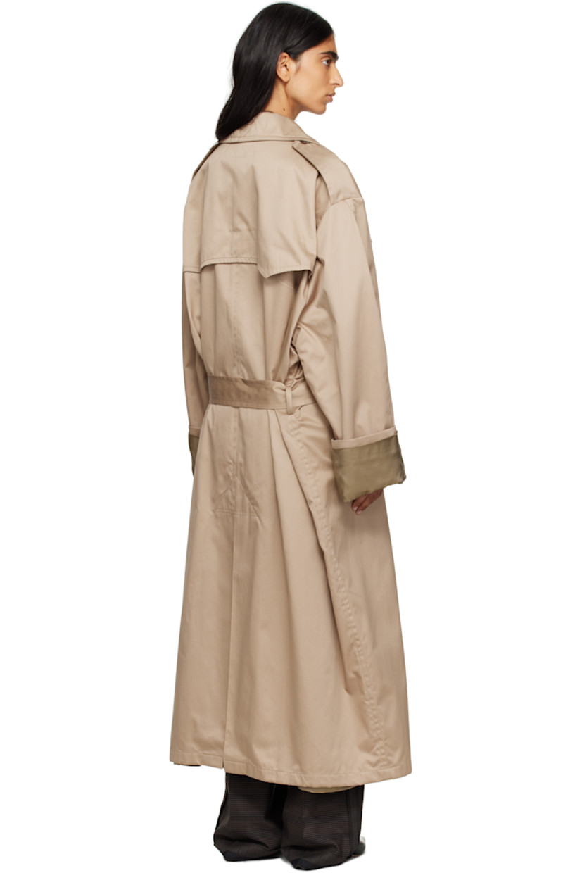 Cotton gabardine trench coat.

· Notched lapel
· Double-breasted button closure
· Storm flap at chest and back
· Belt loops and detachable pin-buckle belt
· Welt pockets at waist
· Epaulets
· Rolled cuffs
· White stitching at back collar
· Central vent at back hem
· Welt pocket at interior
· Full satin lining

Supplier color: Sand