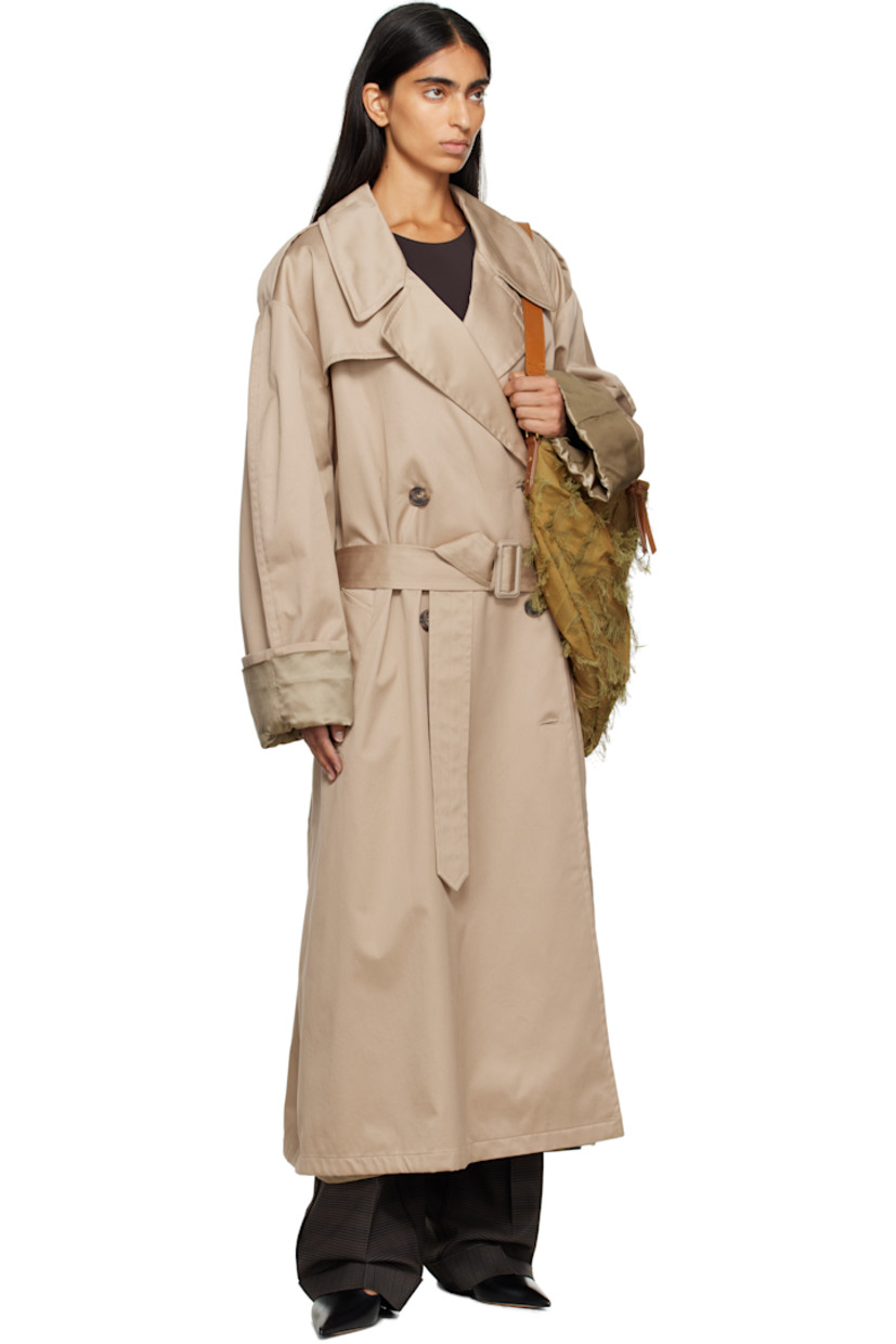 Cotton gabardine trench coat.

· Notched lapel
· Double-breasted button closure
· Storm flap at chest and back
· Belt loops and detachable pin-buckle belt
· Welt pockets at waist
· Epaulets
· Rolled cuffs
· White stitching at back collar
· Central vent at back hem
· Welt pocket at interior
· Full satin lining

Supplier color: Sand