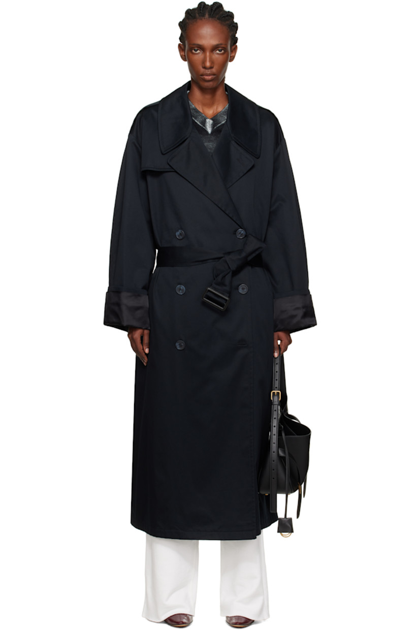 Cotton gabardine trench coat.

· Notched lapel
· Double-breasted button closure
· Storm flap at chest and back
· Belt loops and detachable pin-buckle belt
· Welt pockets at waist
· Epaulets
· Rolled cuffs
· White stitching at back collar
· Central vent at back hem
· Welt pocket at interior
· Full satin lining

Supplier color: Black