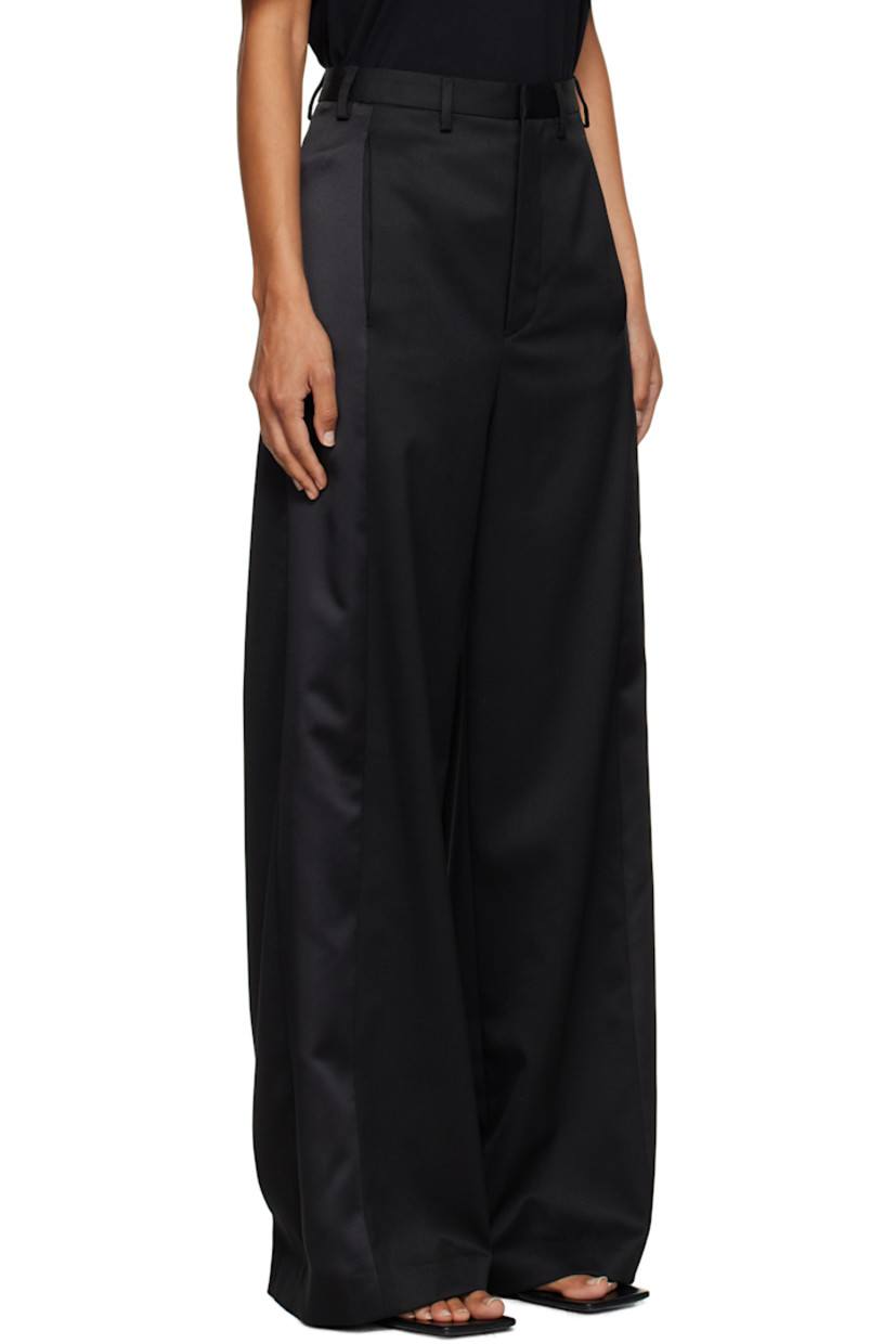 Stretch virgin wool-blend twill trousers.

· Paneled construction
· Belt loops
· Three-pocket styling
· Zip fly
· White stitching at back

Supplier color: Black