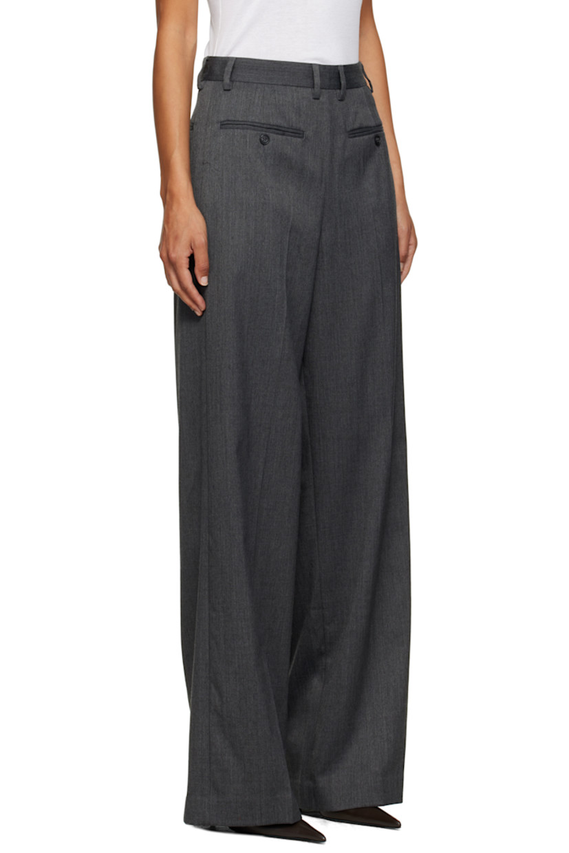 Stretch virgin wool-blend twill trousers.

· Reverse construction
· Wide-leg
· Belt loops
· Modified four-pocket styling
· Creased legs
· Zip closure at outseam
· White stitching at back

Supplier color: Dark grey