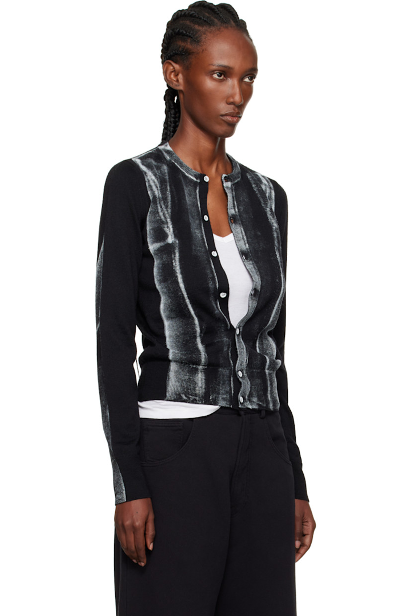 Knit virgin wool-blend cardigan.

· Rib-knit crewneck, hem, and cuffs
· Button closure
· Spray-dyed detailing at front and sleeves
· White stitching at back collar

Supplier color: Black