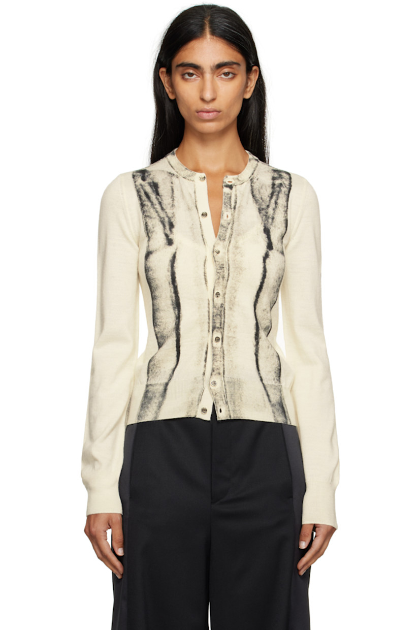 Knit virgin wool-blend cardigan.

· Rib-knit crewneck, hem, and cuffs
· Button closure
· Spray-dyed detailing at front and sleeves
· White stitching at back collar

Supplier color: Off white