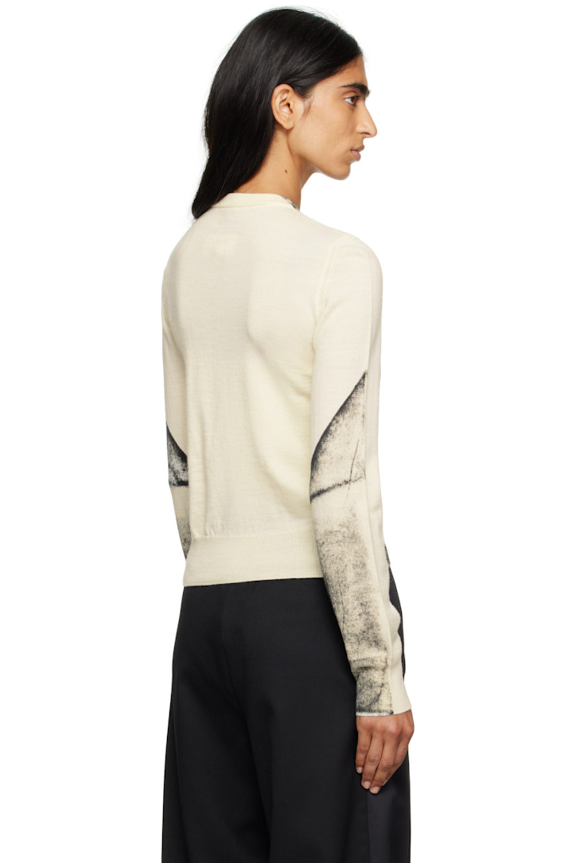 Knit virgin wool-blend cardigan.

· Rib-knit crewneck, hem, and cuffs
· Button closure
· Spray-dyed detailing at front and sleeves
· White stitching at back collar

Supplier color: Off white