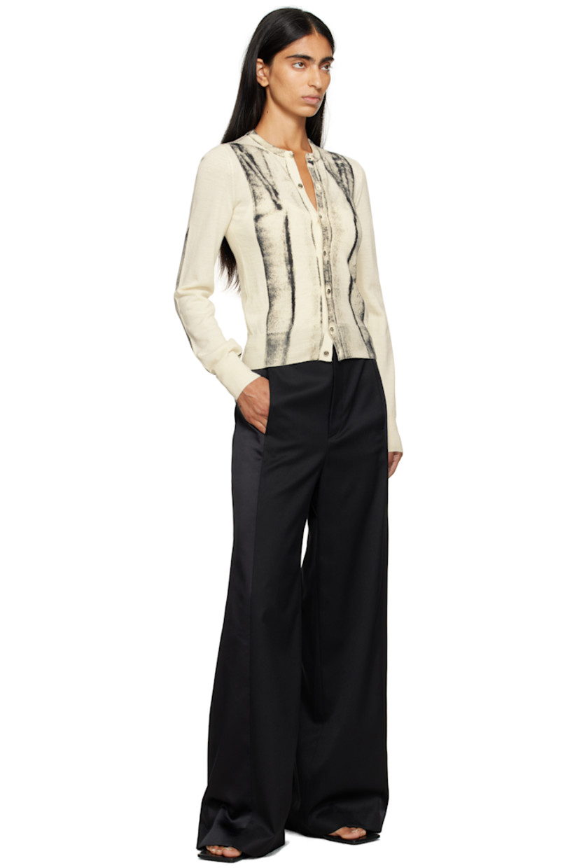 Knit virgin wool-blend cardigan.

· Rib-knit crewneck, hem, and cuffs
· Button closure
· Spray-dyed detailing at front and sleeves
· White stitching at back collar

Supplier color: Off white
