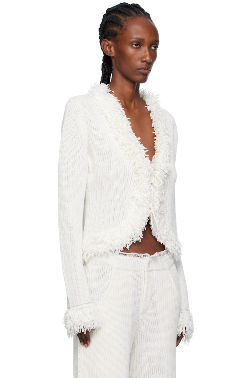 Rib-knit linen- and cotton-blend cardigan.

· Fringed trim at Y-neck, hem, and cuffs
· Self-tie closure

Supplier color: Milk