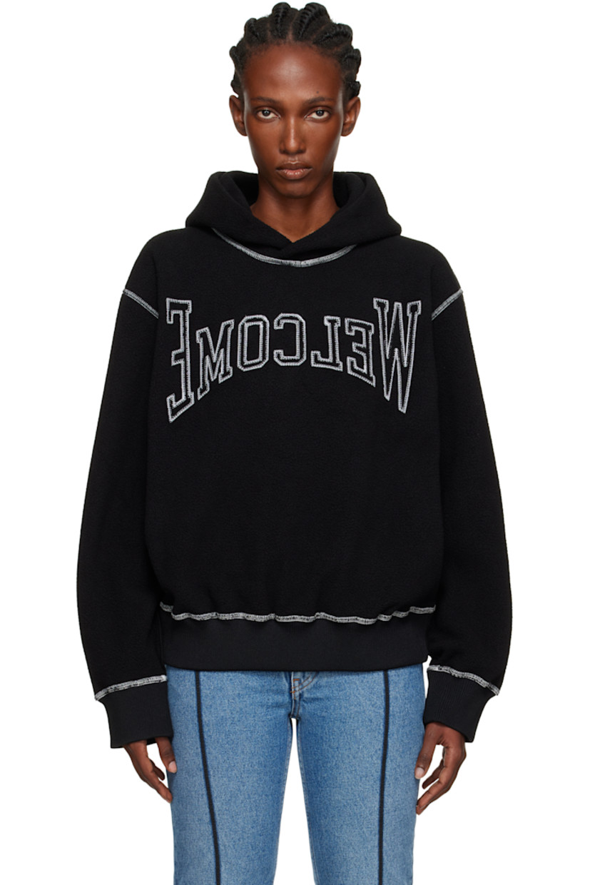 Fleece hoodie.

· Text embroidered at front
· Rib-knit hem and cuffs
· Dropped shoulders
· Contrast stitching in white

Supplier color: Black