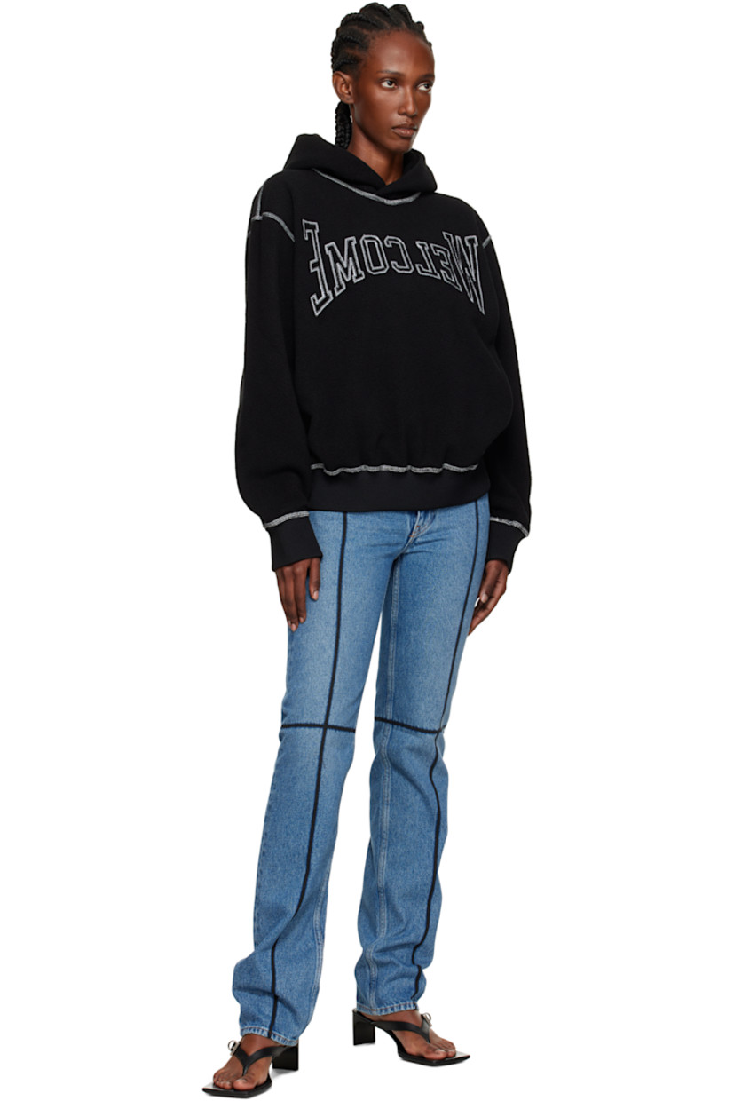 Fleece hoodie.

· Text embroidered at front
· Rib-knit hem and cuffs
· Dropped shoulders
· Contrast stitching in white

Supplier color: Black