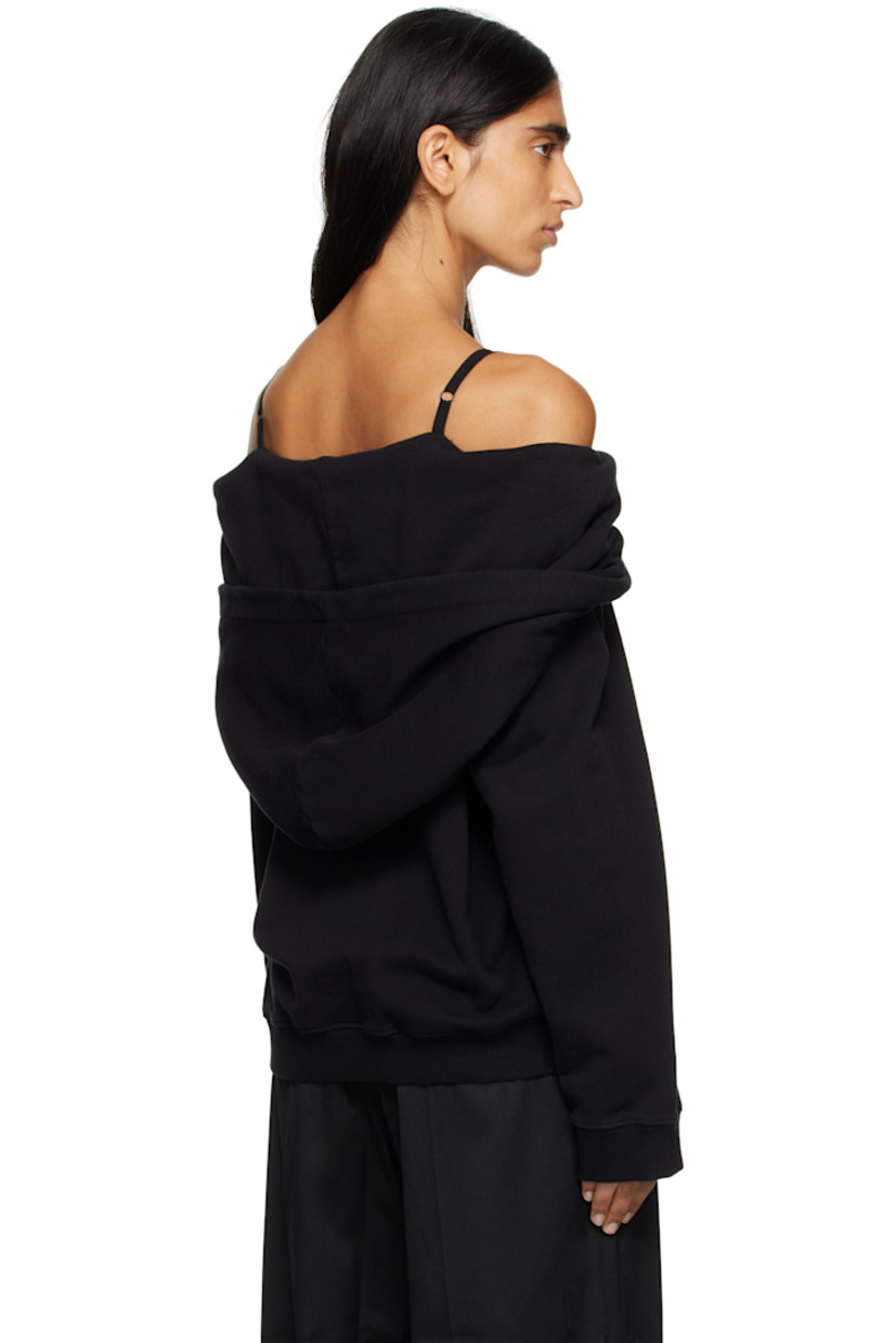 French terry hoodie.

· Off-the-shoulder construction
· Kangaroo pocket
· Rib-knit hem and cuffs
· Logo flag at side seam
· White stitching at back

Supplier color: Black