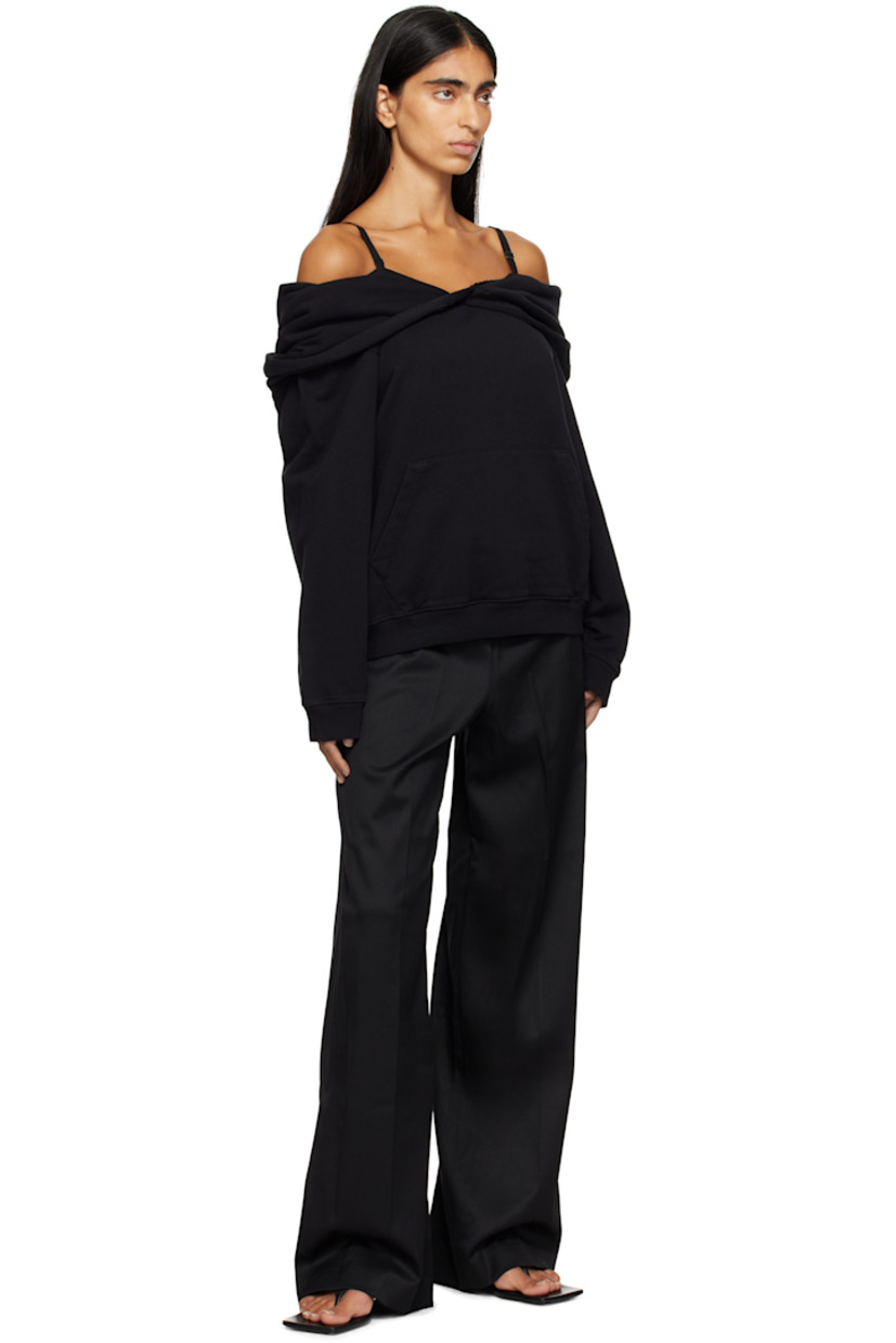 French terry hoodie.

· Off-the-shoulder construction
· Kangaroo pocket
· Rib-knit hem and cuffs
· Logo flag at side seam
· White stitching at back

Supplier color: Black