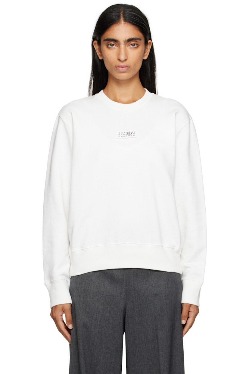Cotton French terry sweatshirt.

· Rib-knit crewneck, hem, and cuffs
· Logo patch at chest
· White stitching at back collar

Supplier color: Off white