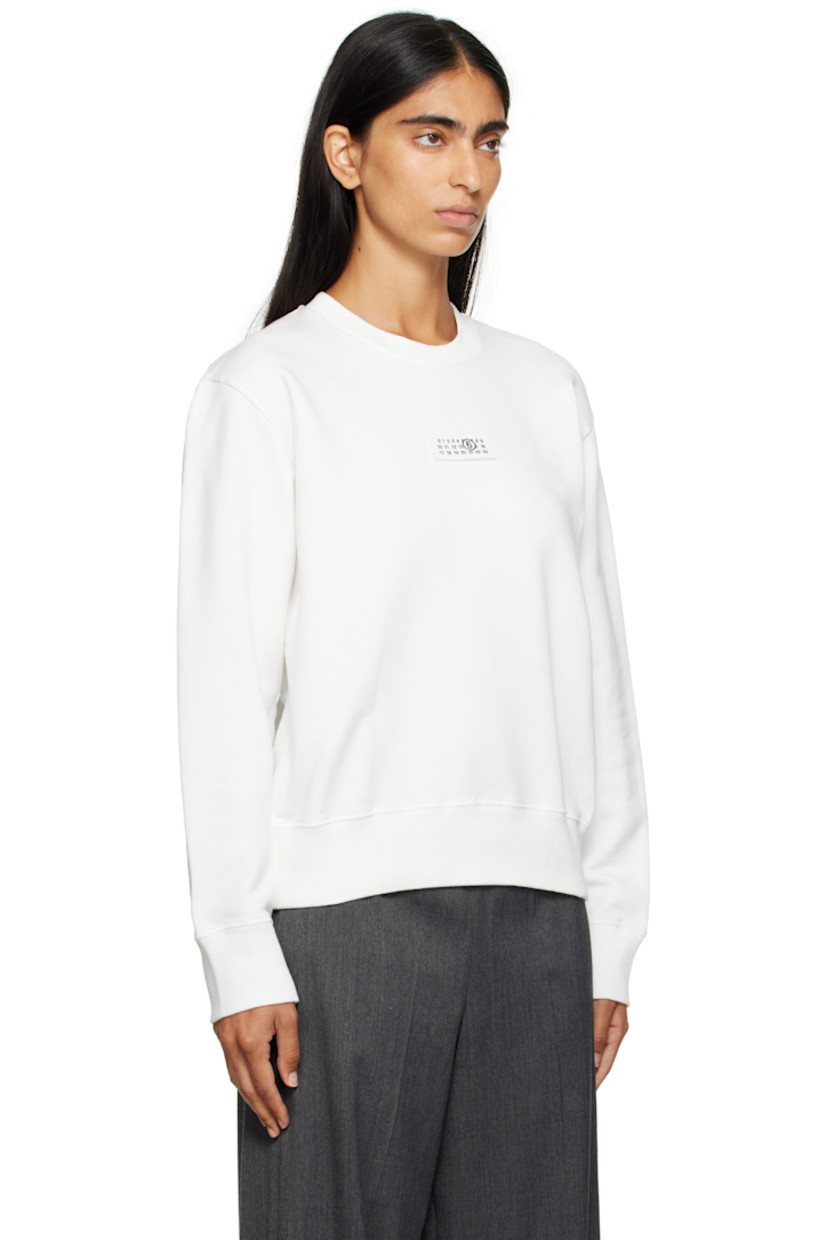 Cotton French terry sweatshirt.

· Rib-knit crewneck, hem, and cuffs
· Logo patch at chest
· White stitching at back collar

Supplier color: Off white
