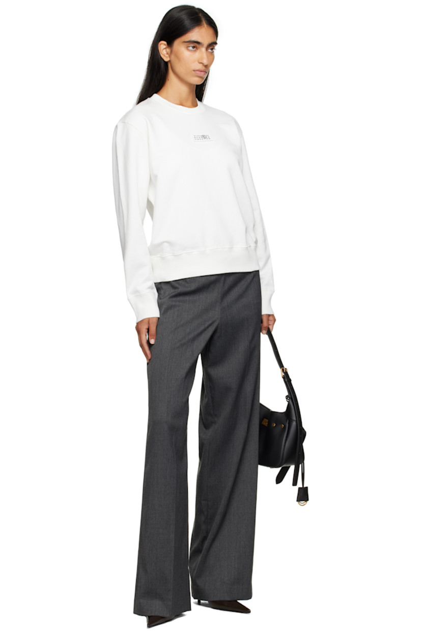 Cotton French terry sweatshirt.

· Rib-knit crewneck, hem, and cuffs
· Logo patch at chest
· White stitching at back collar

Supplier color: Off white