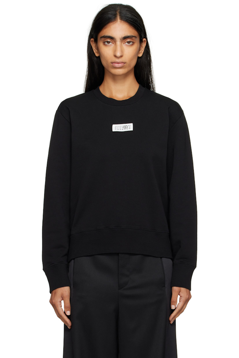 Cotton French terry sweatshirt.

· Rib-knit crewneck, hem, and cuffs
· Logo patch at chest
· White stitching at back collar

Supplier color: Black