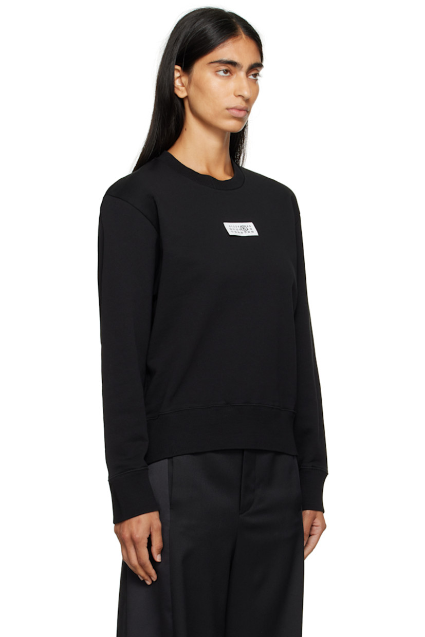 Cotton French terry sweatshirt.

· Rib-knit crewneck, hem, and cuffs
· Logo patch at chest
· White stitching at back collar

Supplier color: Black