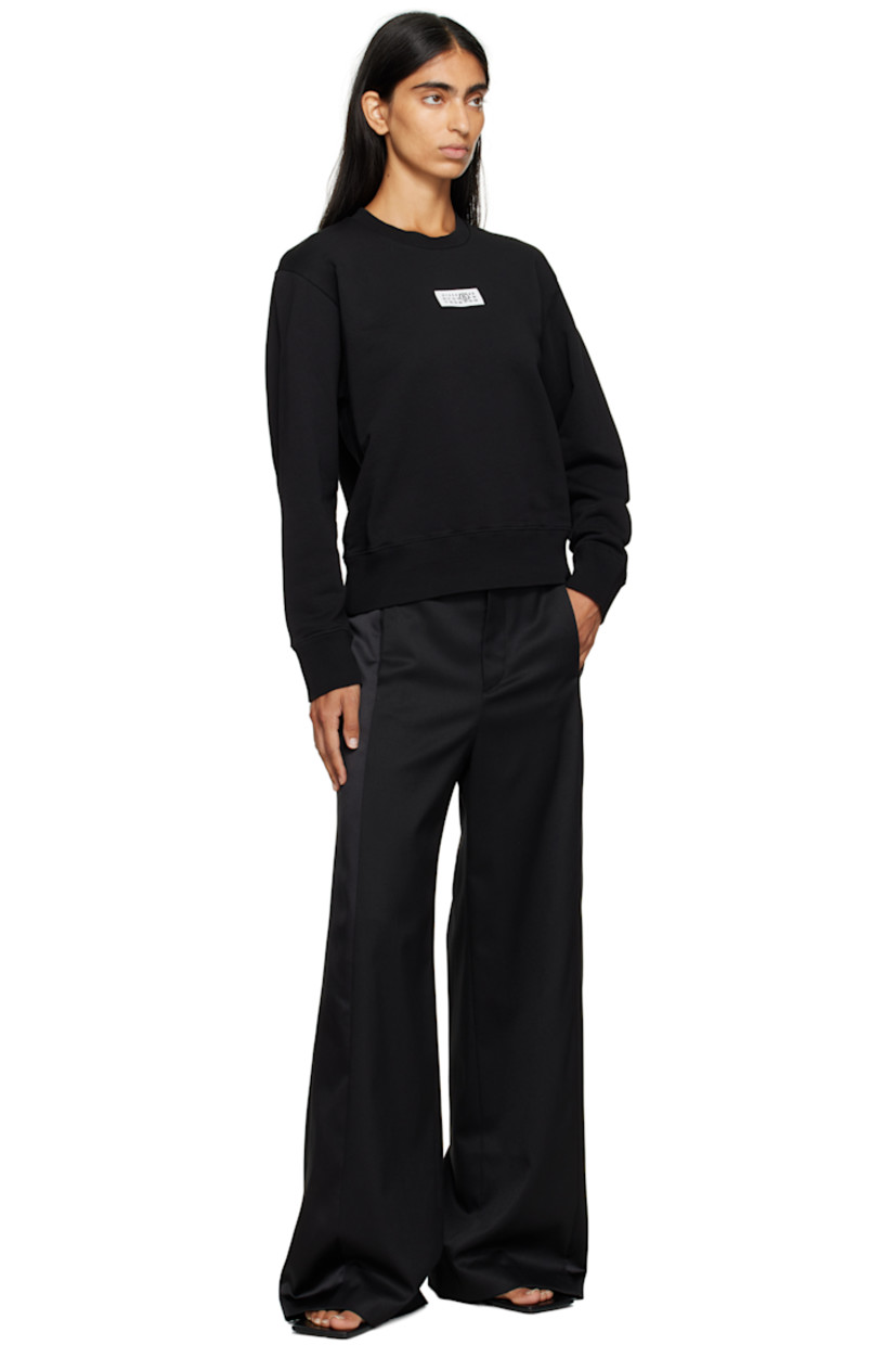 Cotton French terry sweatshirt.

· Rib-knit crewneck, hem, and cuffs
· Logo patch at chest
· White stitching at back collar

Supplier color: Black