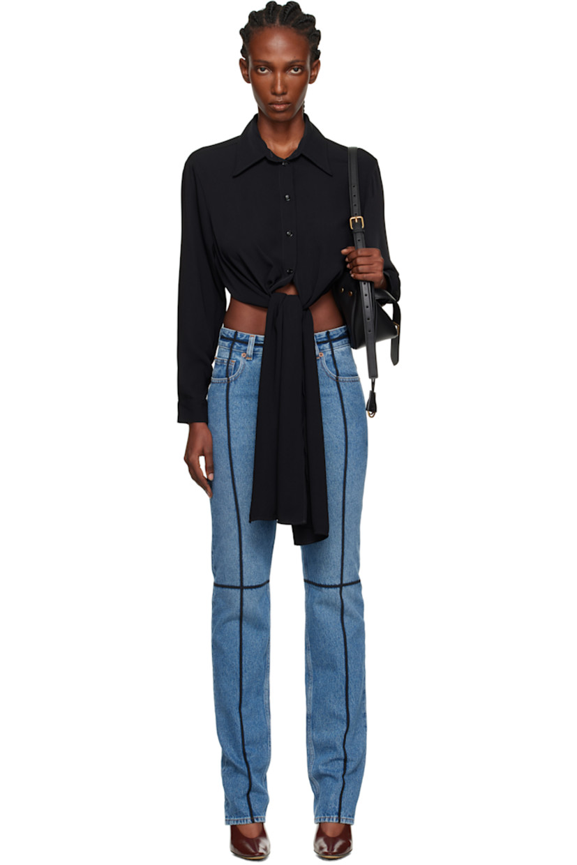 Crêpe shirt.

· Spread collar
· Button closure
· Extended self-tie fastening at front hem
· Cropped hem
· Buttoned barrel cuffs
· White stitching at back collar

Supplier color: Black