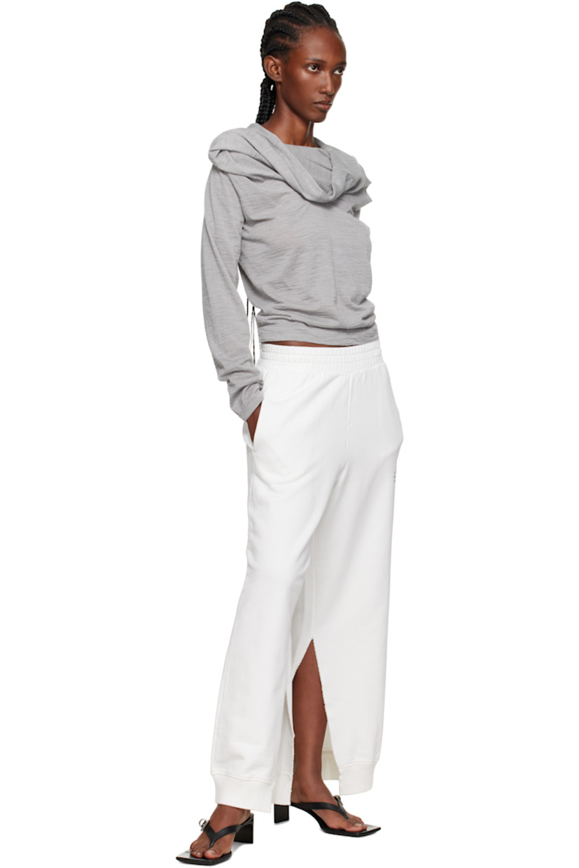 Virgin wool-blend jersey top.

· Draping throughout
· Cowl neck
· Pleats at chest
· White stitching at back collar

Supplier color: Medium grey melange