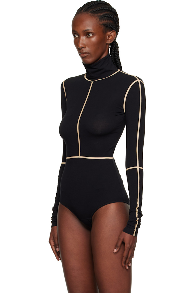 Stretch cotton jersey bodysuit.

· Taped seams throughout
· Turtleneck
· Press-stud fastening at bottom
· White stitching at back collar

Supplier color: Black