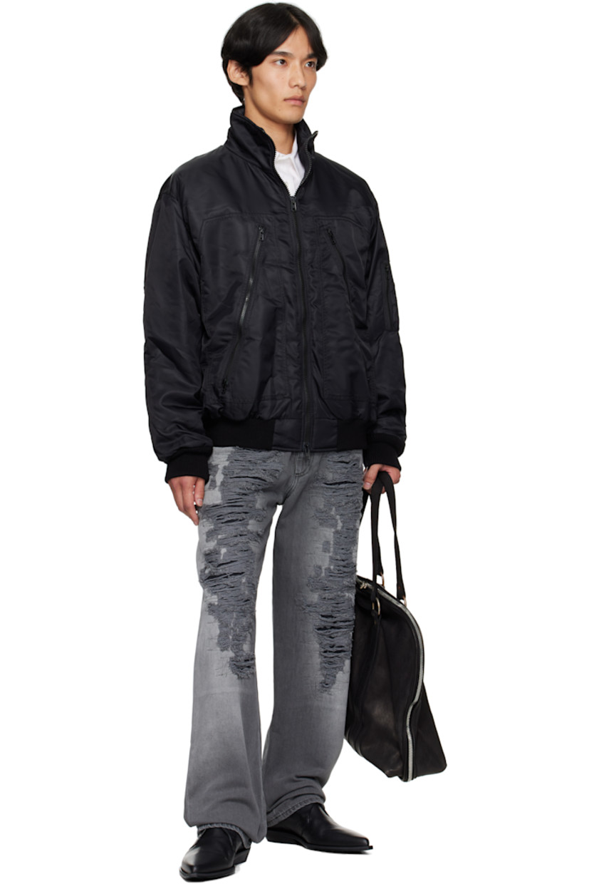 Insulated nylon twill bomber jacket. 

· Stand collar
· Two-way zip closure
· Zip pockets at front 
· Rib-knit hem and cuffs 
· Utility pocket and pen slots at sleeve
· White stitching at back collar 
· Patch pocket at interior 
· Quilted viscose satin twill lining 

Supplier color: Black
