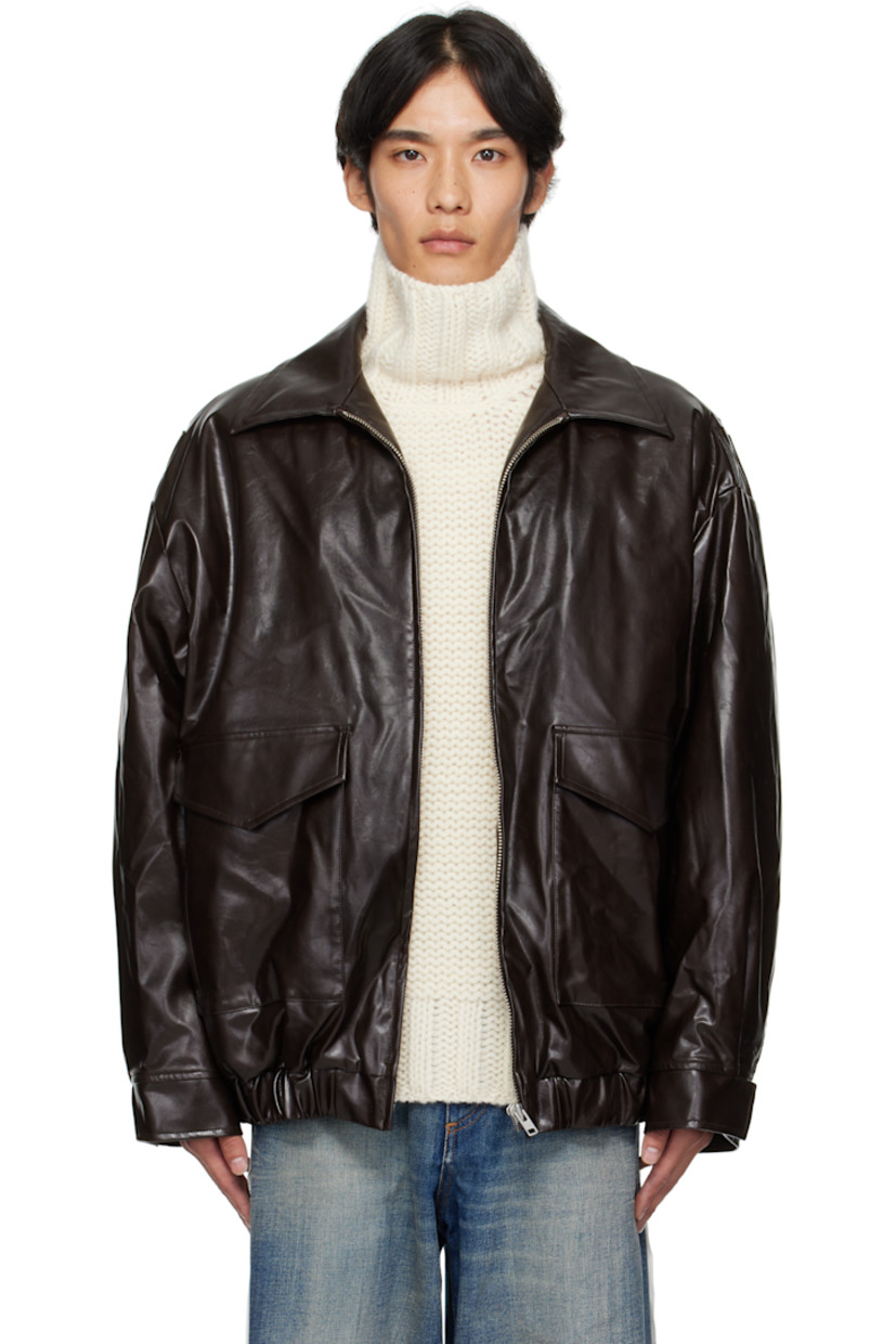 Insulated grained faux-leather jacket. 

· Spread collar
· Zip closure
· Flap pockets at front 
· Elasticized hem and cuffs
· White stitching at back collar 
· Welt pocket at interior 
· Full satin twill lining 

Supplier color: Burgundy