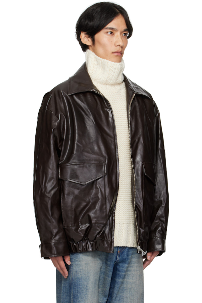 Insulated grained faux-leather jacket. 

· Spread collar
· Zip closure
· Flap pockets at front 
· Elasticized hem and cuffs
· White stitching at back collar 
· Welt pocket at interior 
· Full satin twill lining 

Supplier color: Burgundy