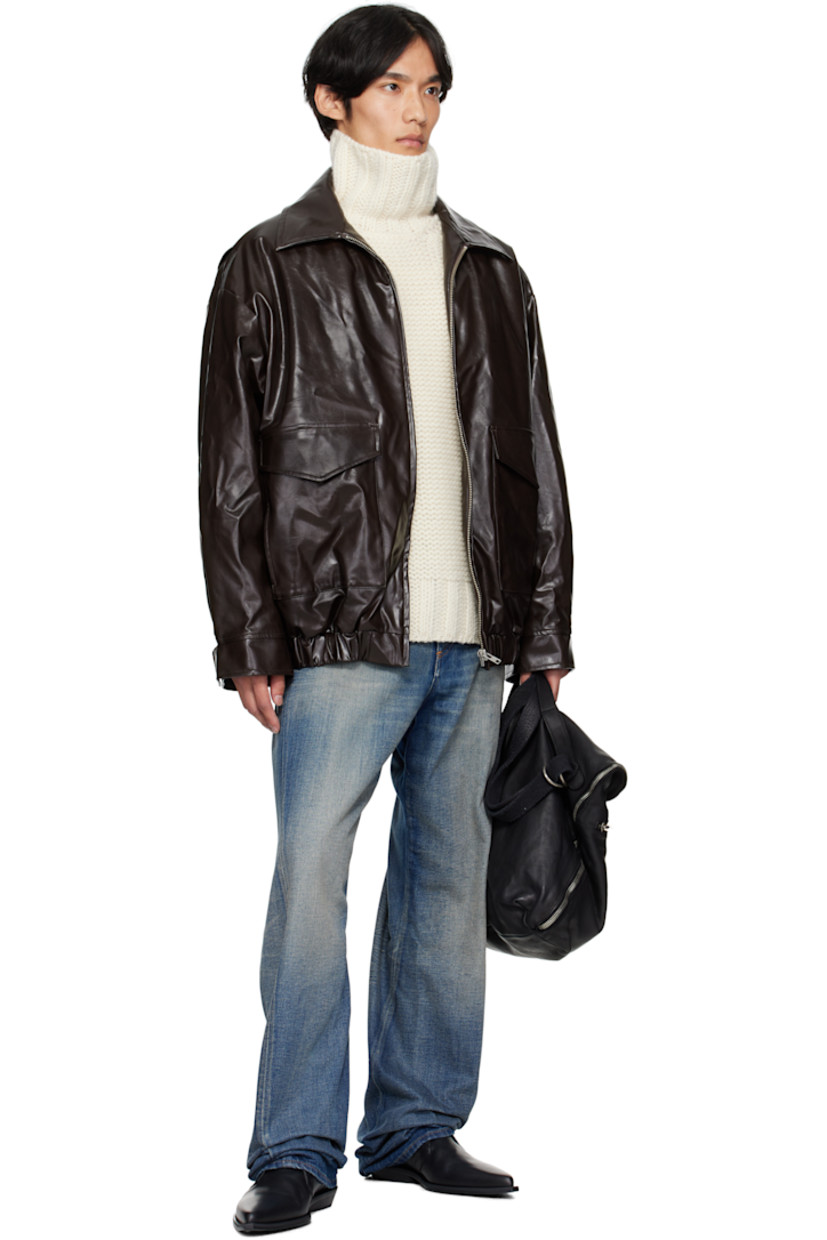 Insulated grained faux-leather jacket. 

· Spread collar
· Zip closure
· Flap pockets at front 
· Elasticized hem and cuffs
· White stitching at back collar 
· Welt pocket at interior 
· Full satin twill lining 

Supplier color: Burgundy