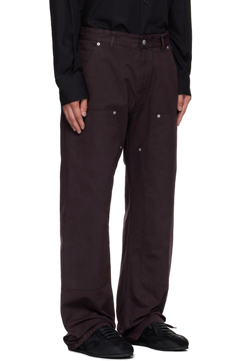 Cotton canvas jeans.

· Belt loops
· Five-pocket styling
· Zip fly 
· Reinforced panel and rivets at legs
· White stitching at back waist
· Logo patch at back pocket 

Supplier color: Dark wine