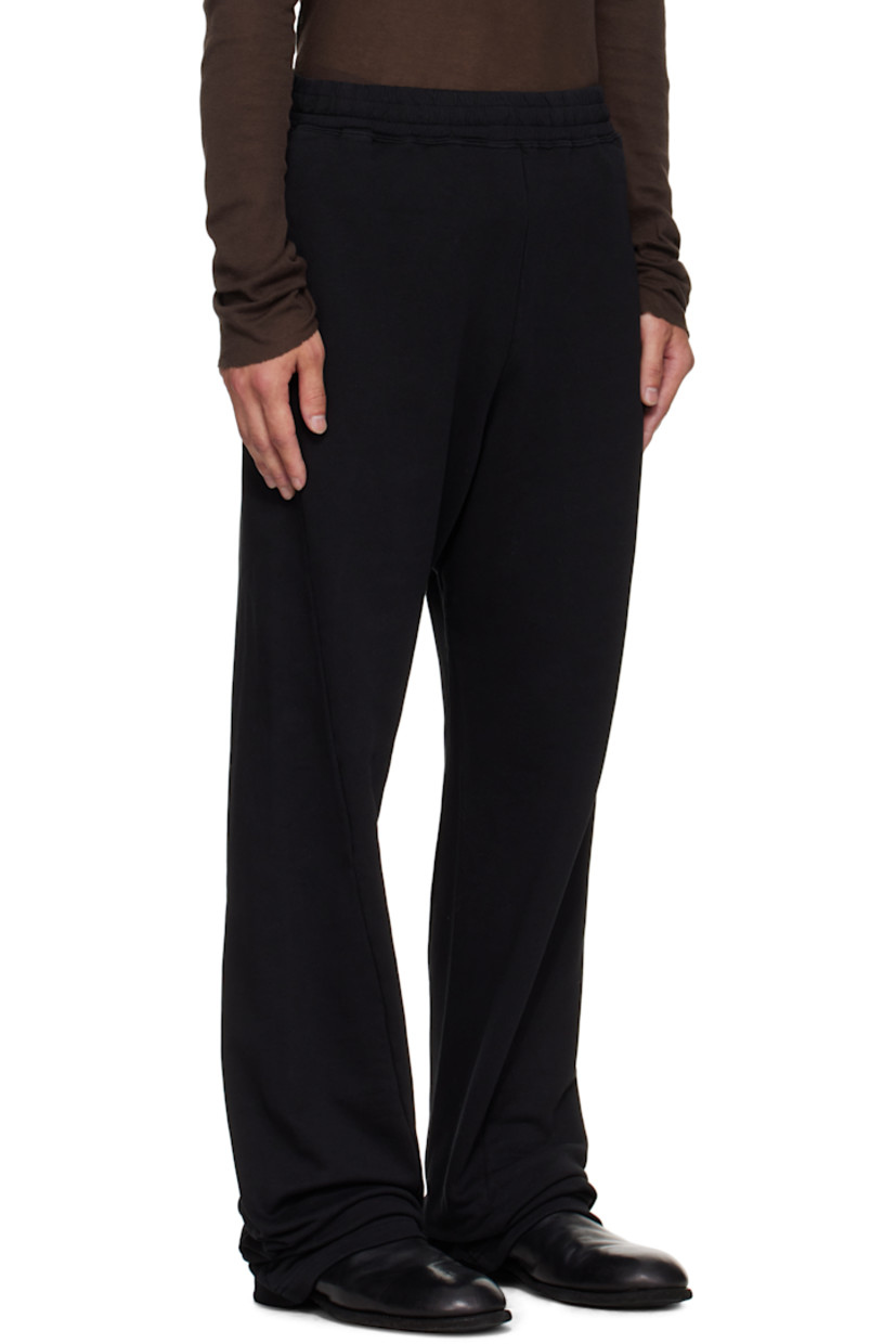 French terry sweatpants.

· Drawstring at elasticized waistband
· Three-pocket styling
· White stitching at back waist 
· Logo embroidered at back pocket 

Supplier color: Black