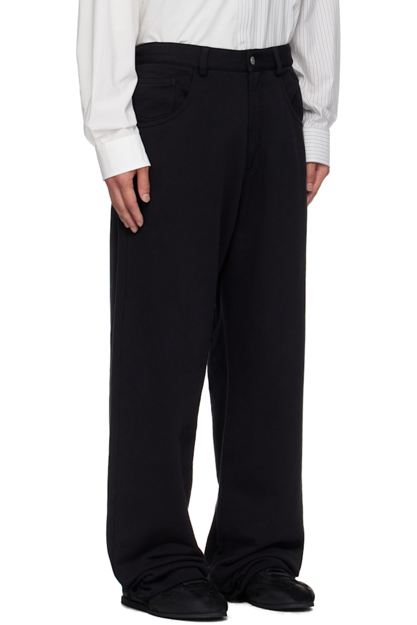 French terry trousers.

· Wide-leg 
· Concealed drawstring at elasticized waistband
· Belt loops
· Zip fly 
· Five-pocket styling
· Raw edge at cuffs 
· White stitching at back waist 

Supplier color: Black