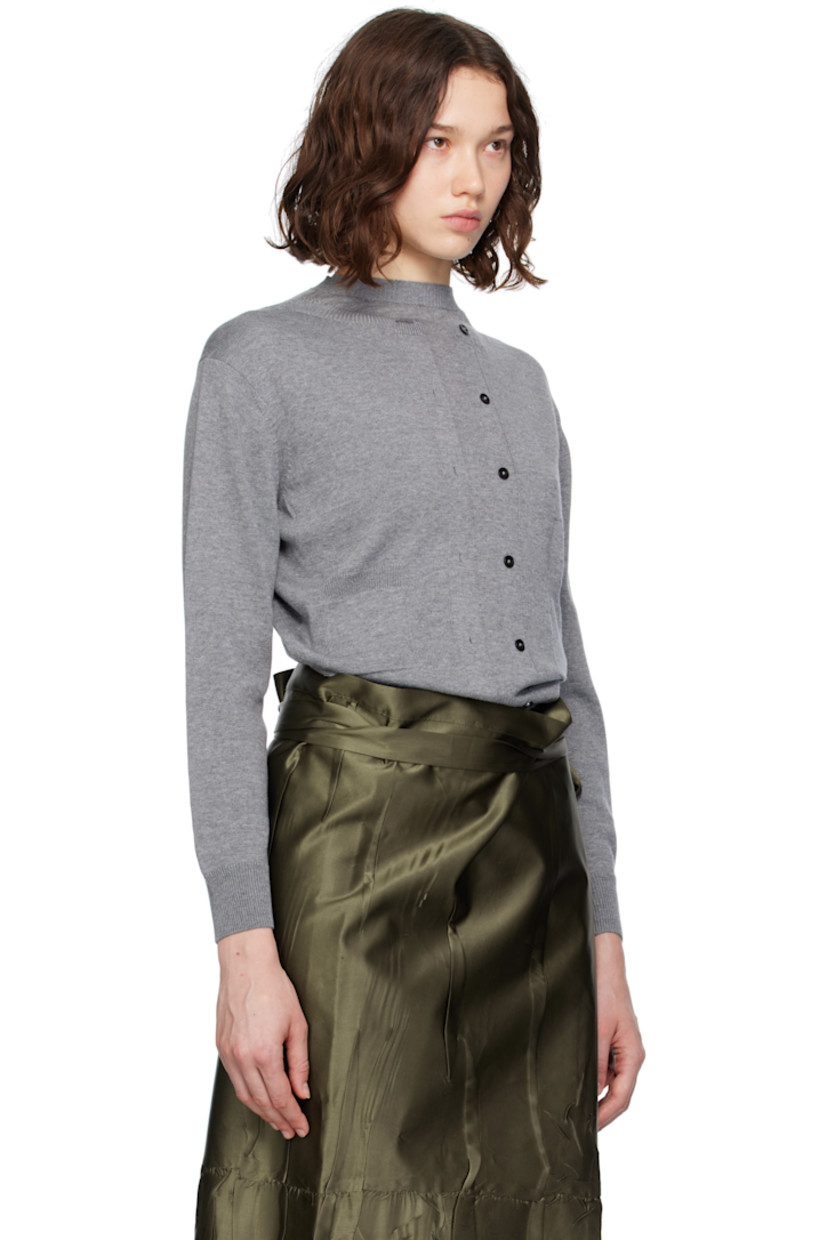 Knit wool- and cotton-blend cardigan. Rib-knit trim throughout.

· Crewneck
· Button placket and buttonholes at front
· Button closure and cutout at back

Supplier color: Grey