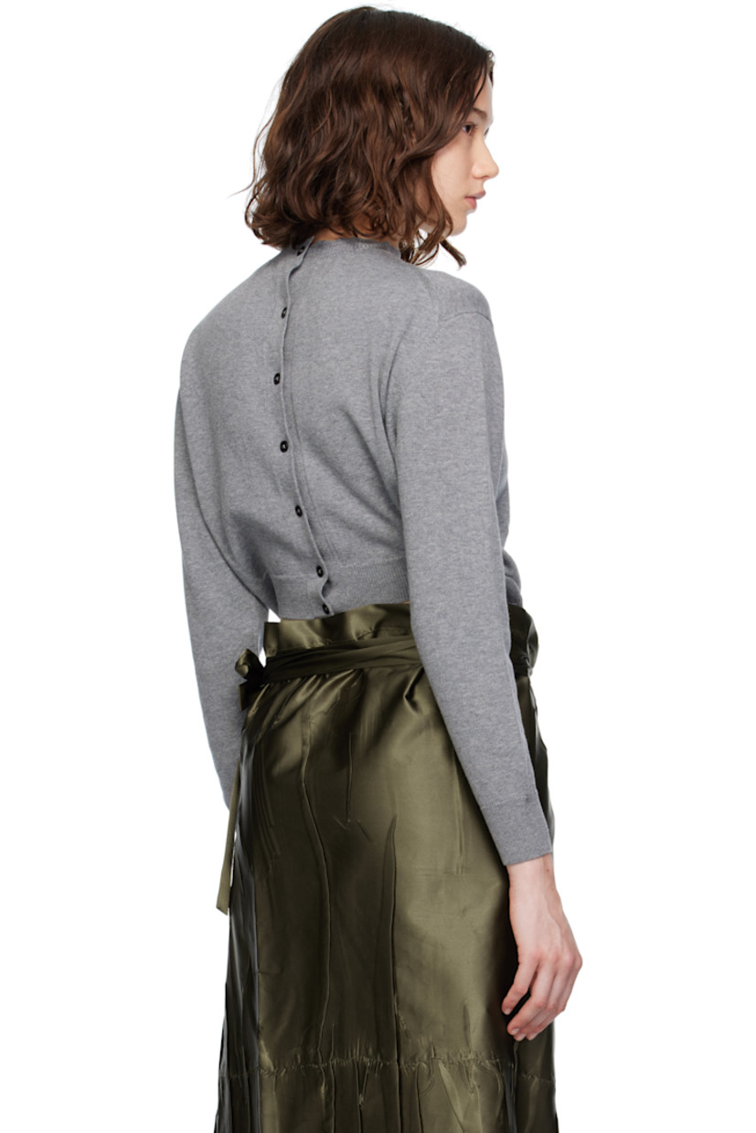 Knit wool- and cotton-blend cardigan. Rib-knit trim throughout.

· Crewneck
· Button placket and buttonholes at front
· Button closure and cutout at back

Supplier color: Grey