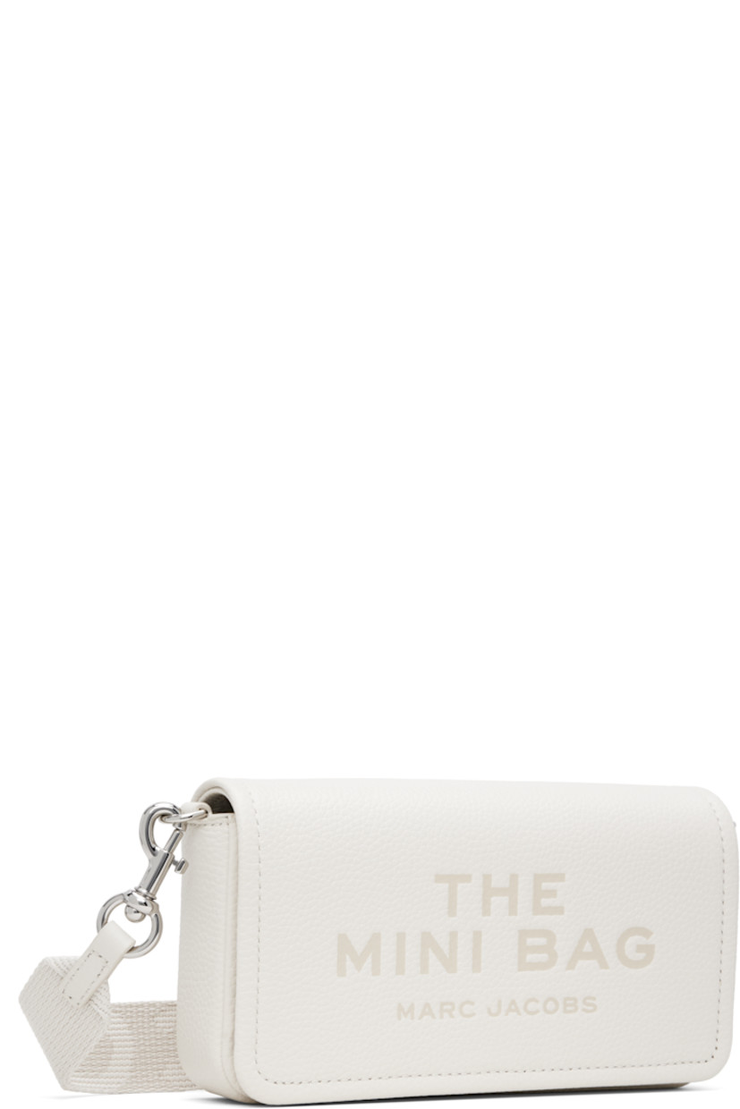 Structured pebble-grained leather shoulder bag in off-white.

· Adjustable and detachable logo-woven crossbody strap
· Text and logo embossed at face
· Logo patch at back face
· Magnetic flap
· Patch pocket at interior
· Eight card slots 
· Twill lining
· Logo-engraved silver-tone hardware
· H5" x W8" x D2"

Part of THE™ collection.

Supplier color: Cotton