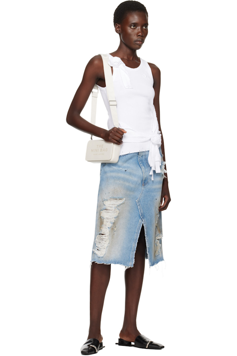 Structured pebble-grained leather shoulder bag in off-white.

· Adjustable and detachable logo-woven crossbody strap
· Text and logo embossed at face
· Logo patch at back face
· Magnetic flap
· Patch pocket at interior
· Eight card slots 
· Twill lining
· Logo-engraved silver-tone hardware
· H5" x W8" x D2"

Part of THE™ collection.

Supplier color: Cotton