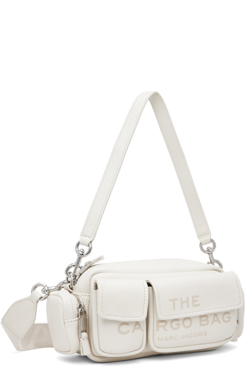 Pebble-grained leather shoulder bag in off-white.

· Detachable shoulder strap
· Adjustable and detachable logo-woven crossbody strap
· Text and logo embossed at face
· Flap pockets
· Zip pocket at sides
· Logo patch at back face
· Zip closure 
· Logo-engraved silver-tone hardware
· H5" x W9" x D3"

Supplier color: Cotton/Silver