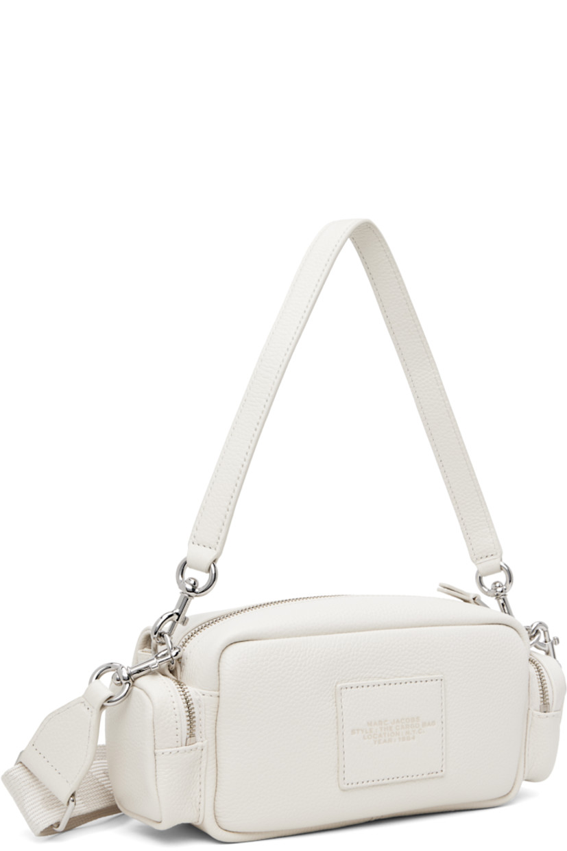Pebble-grained leather shoulder bag in off-white.

· Detachable shoulder strap
· Adjustable and detachable logo-woven crossbody strap
· Text and logo embossed at face
· Flap pockets
· Zip pocket at sides
· Logo patch at back face
· Zip closure 
· Logo-engraved silver-tone hardware
· H5" x W9" x D3"

Supplier color: Cotton/Silver