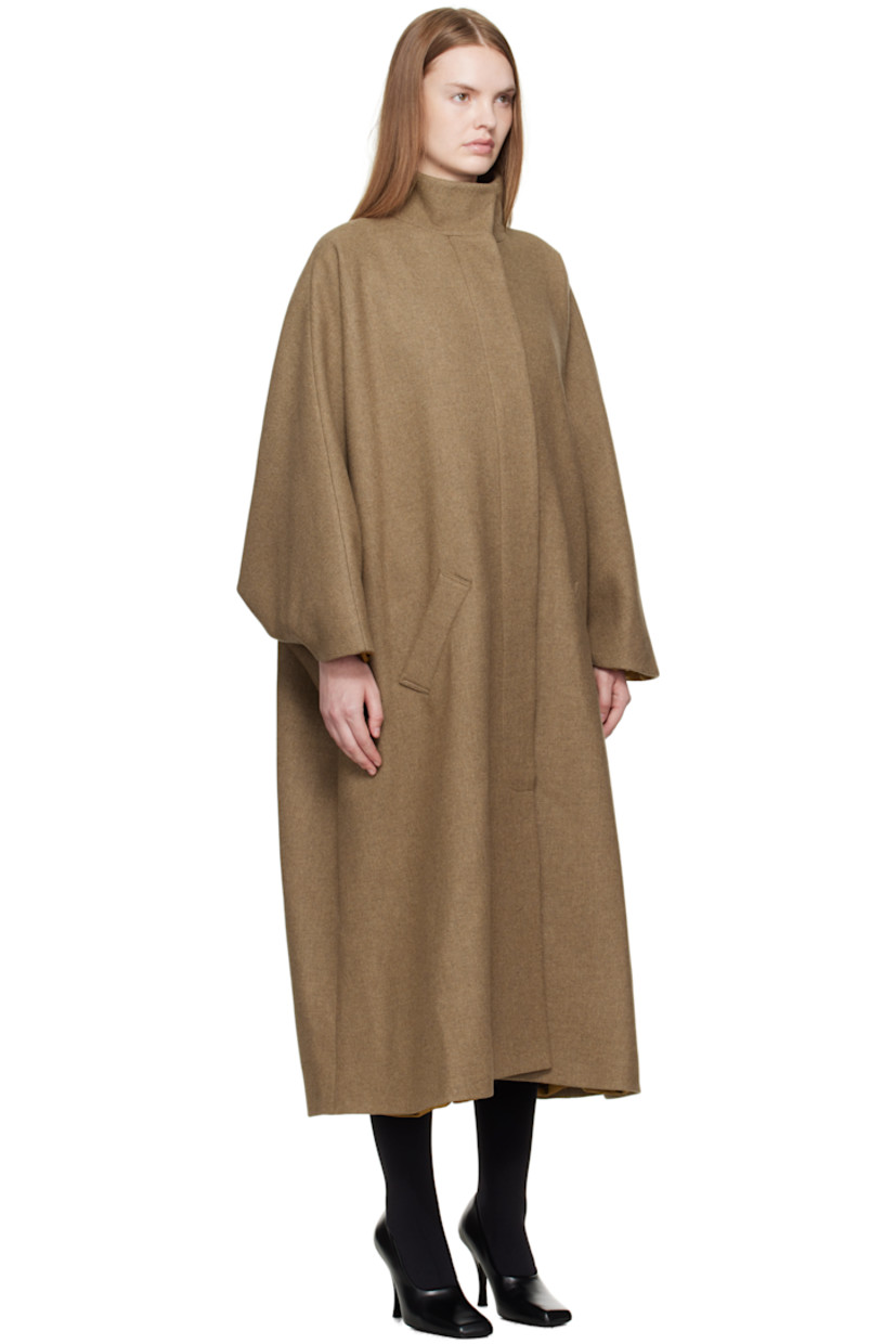 Recycled wool-blend melton coat.

· Funnel neck
· Concealed button closure
· Welt pockets at waist
· Dolman sleeves
· Full silk satin lining

Supplier color: Khaki