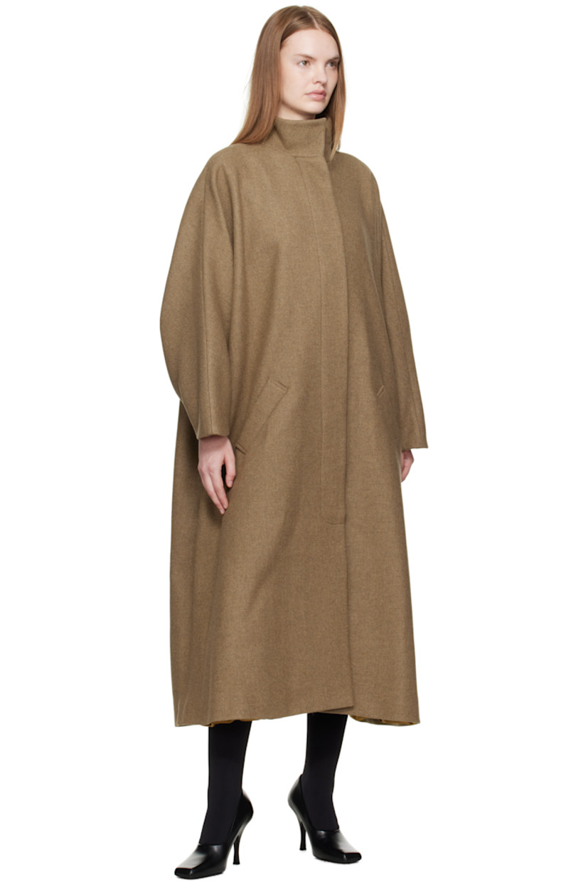 Recycled wool-blend melton coat.

· Funnel neck
· Concealed button closure
· Welt pockets at waist
· Dolman sleeves
· Full silk satin lining

Supplier color: Khaki