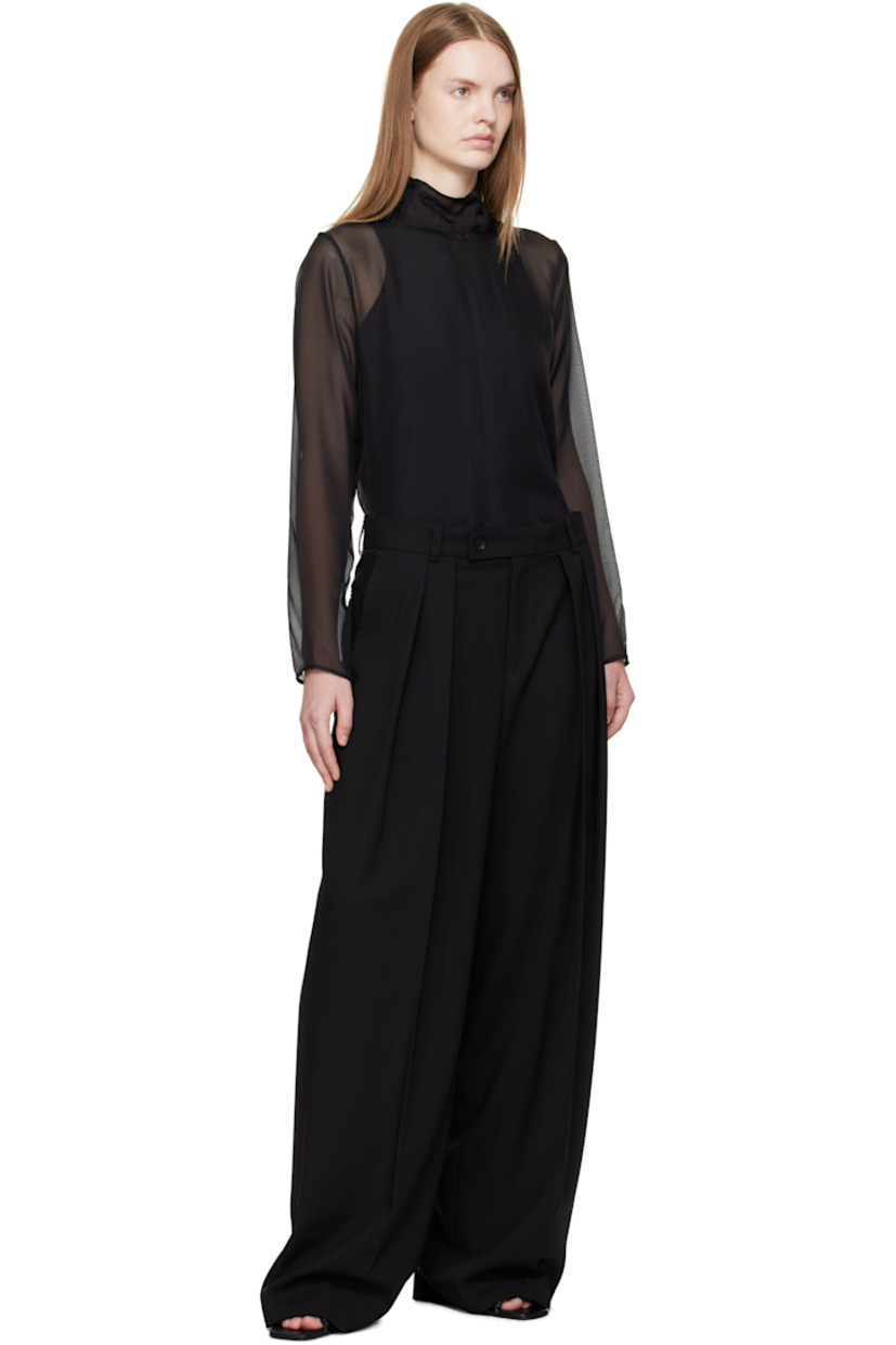 Wool twill trousers.

· Wide-leg
· Mid-to-low rise
· Belt loops
· Four-pocket styling
· Zip fly
· Pleats at front
· Creased legs

Supplier color: Black