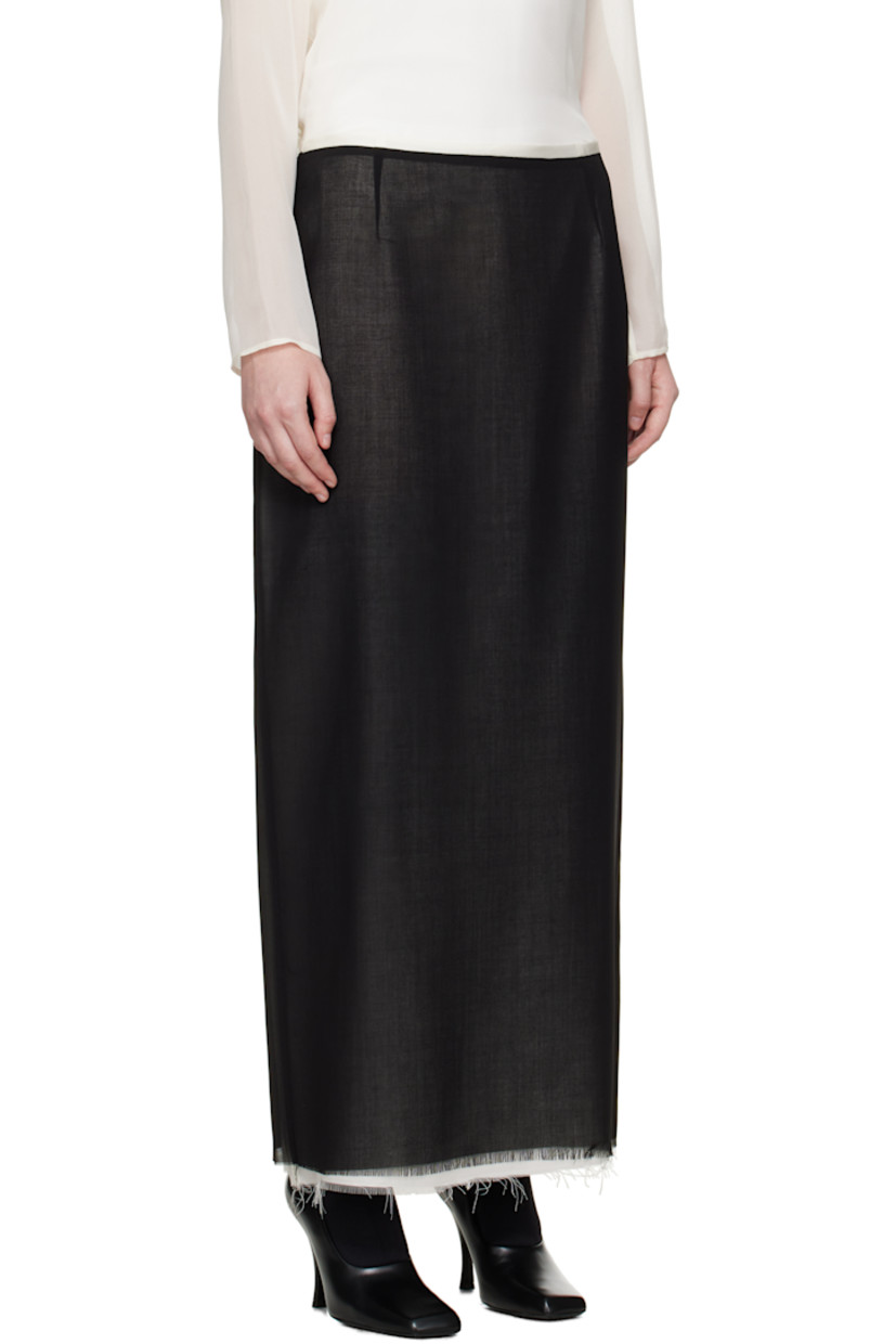 Virgin wool crêpe midi skirt.

· Layered construction
· Raw edge at hem
· Zip closure at side seam
· Central vent at back hem
· Full silk crêpe lining

Supplier color: Black/Off white